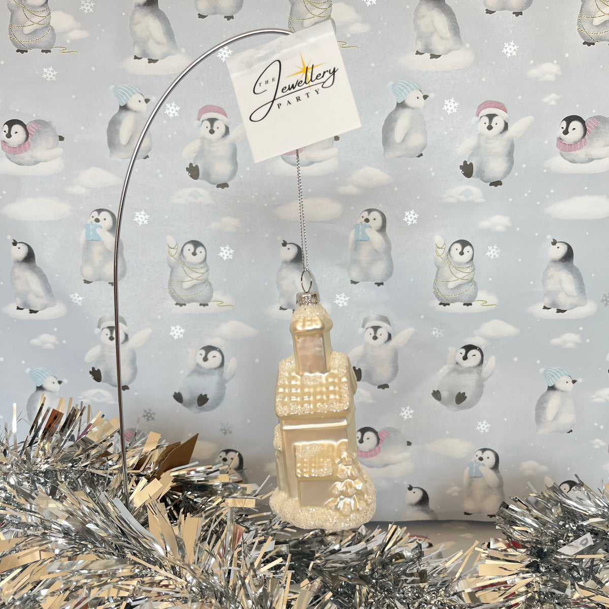 shimmering  champagne glass church Christmas ornament accented with sparkling glitter snow details