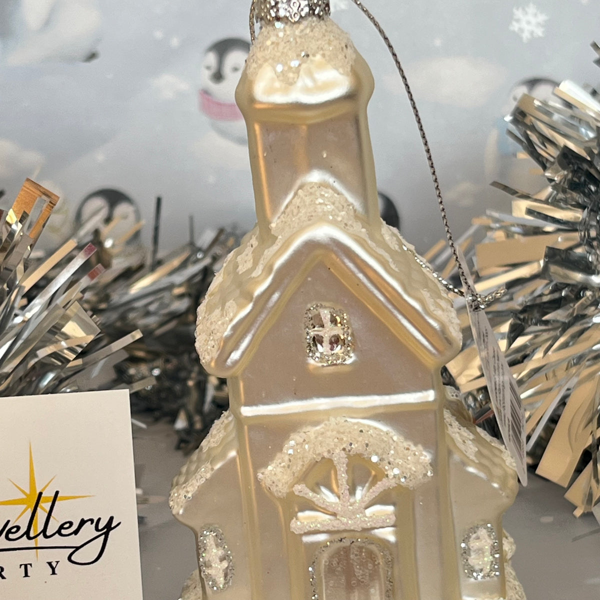 shimmering  champagne glass church Christmas ornament accented with sparkling glitter snow details