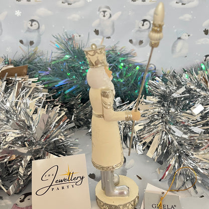 Gisela Graham cream and silver nutcracker figurine holding a staff.