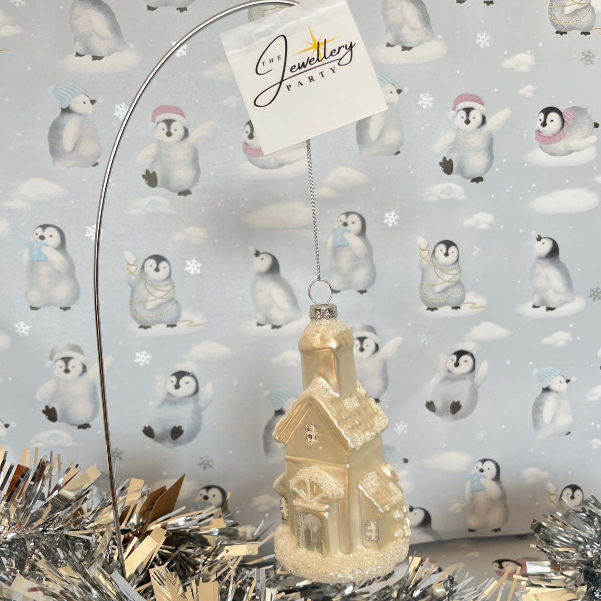 shimmering  champagne glass church Christmas ornament accented with sparkling glitter snow details