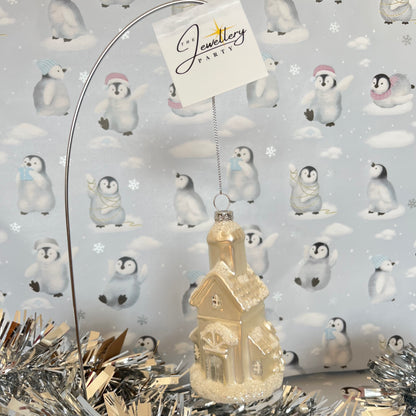 shimmering  champagne glass church Christmas ornament accented with sparkling glitter snow details