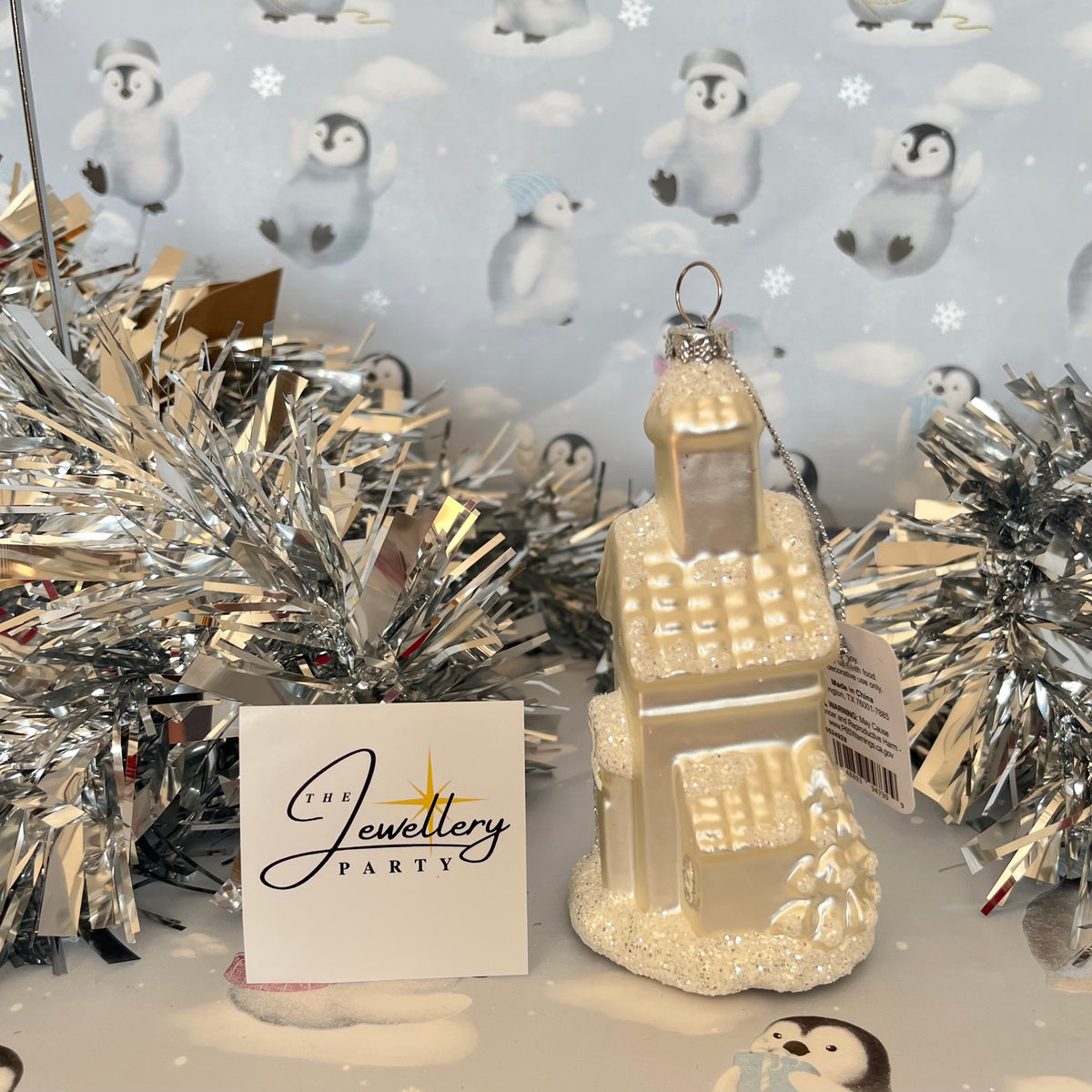 shimmering  champagne glass church Christmas ornament accented with sparkling glitter snow details