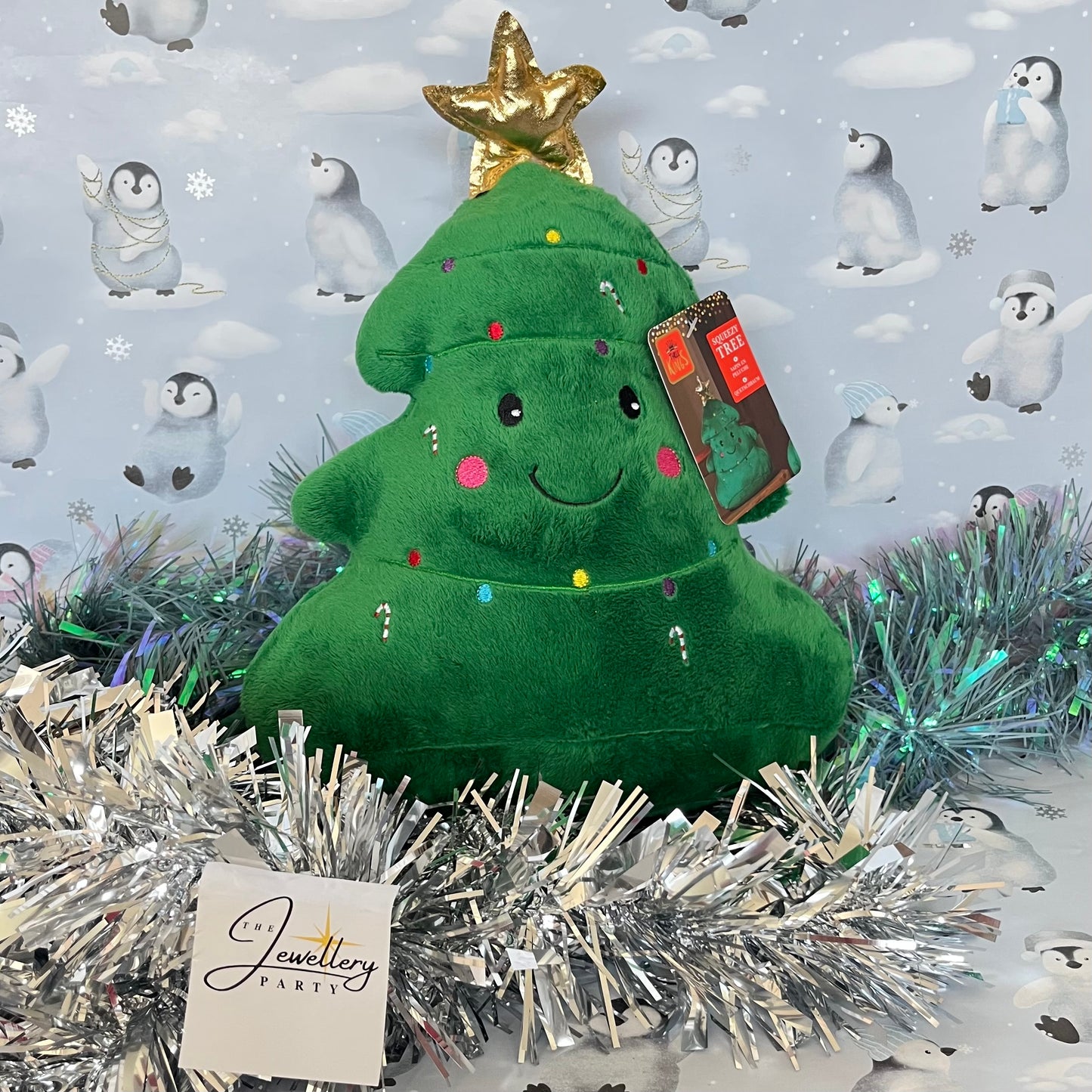 Festive green Squeezies Christmas tree plush toy