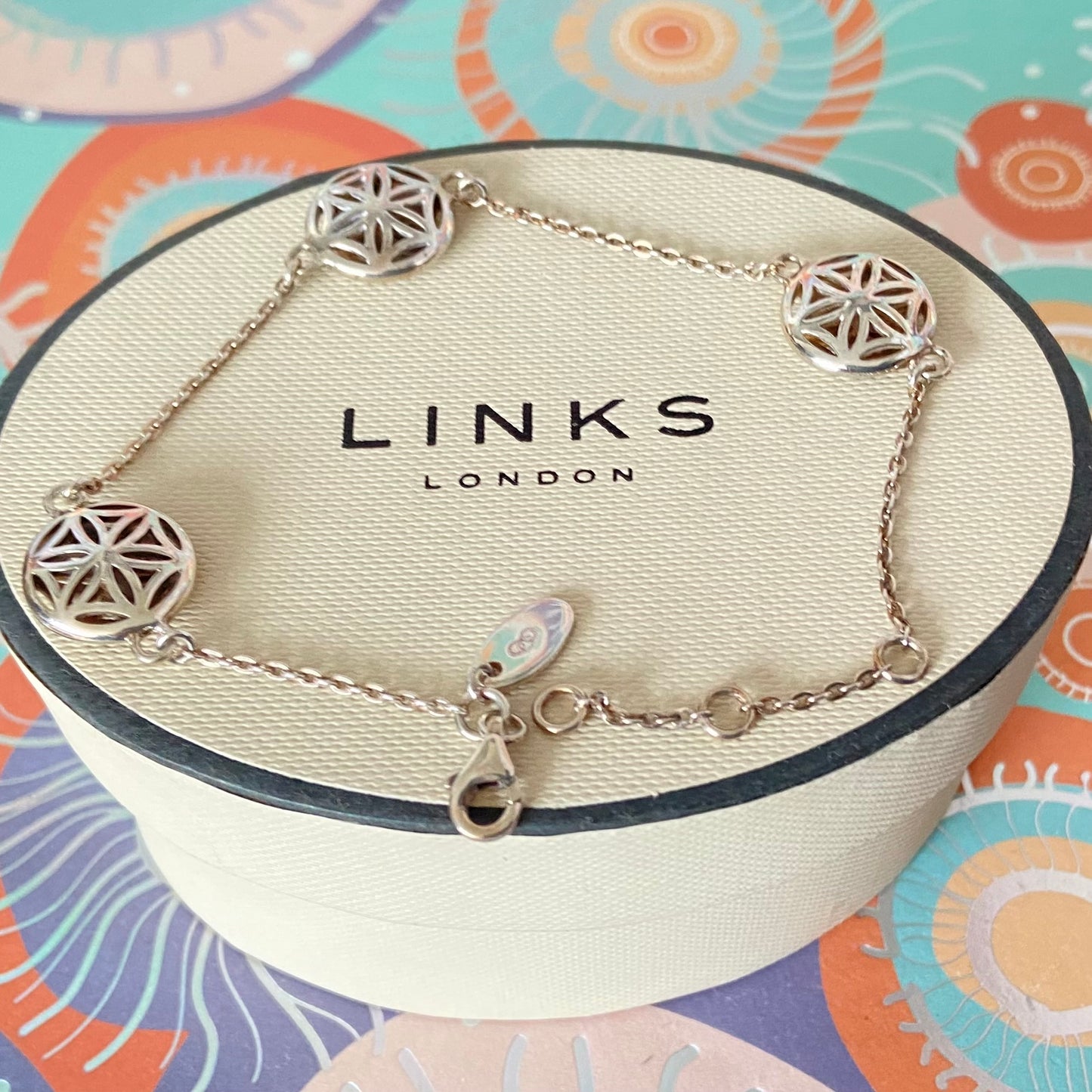 Links of London Bracelet featuring 3 disks with the Flower of Life Design. 20cm adjustable