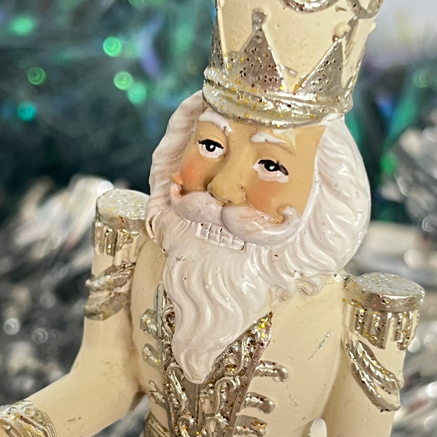 Gisela Graham cream and silver nutcracker figurine holding a staff.