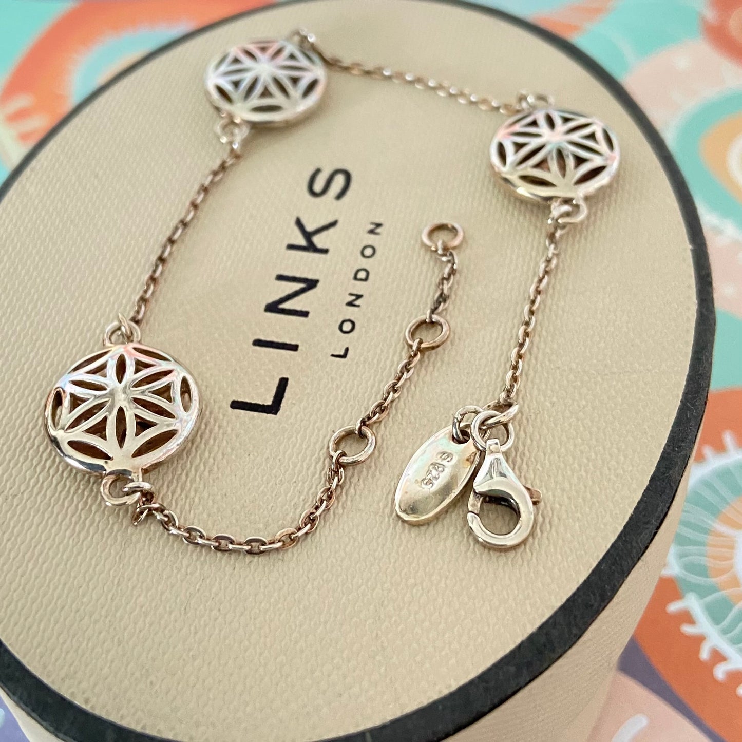 Links of London Bracelet featuring 3 disks with the Flower of Life Design. 20cm adjustable