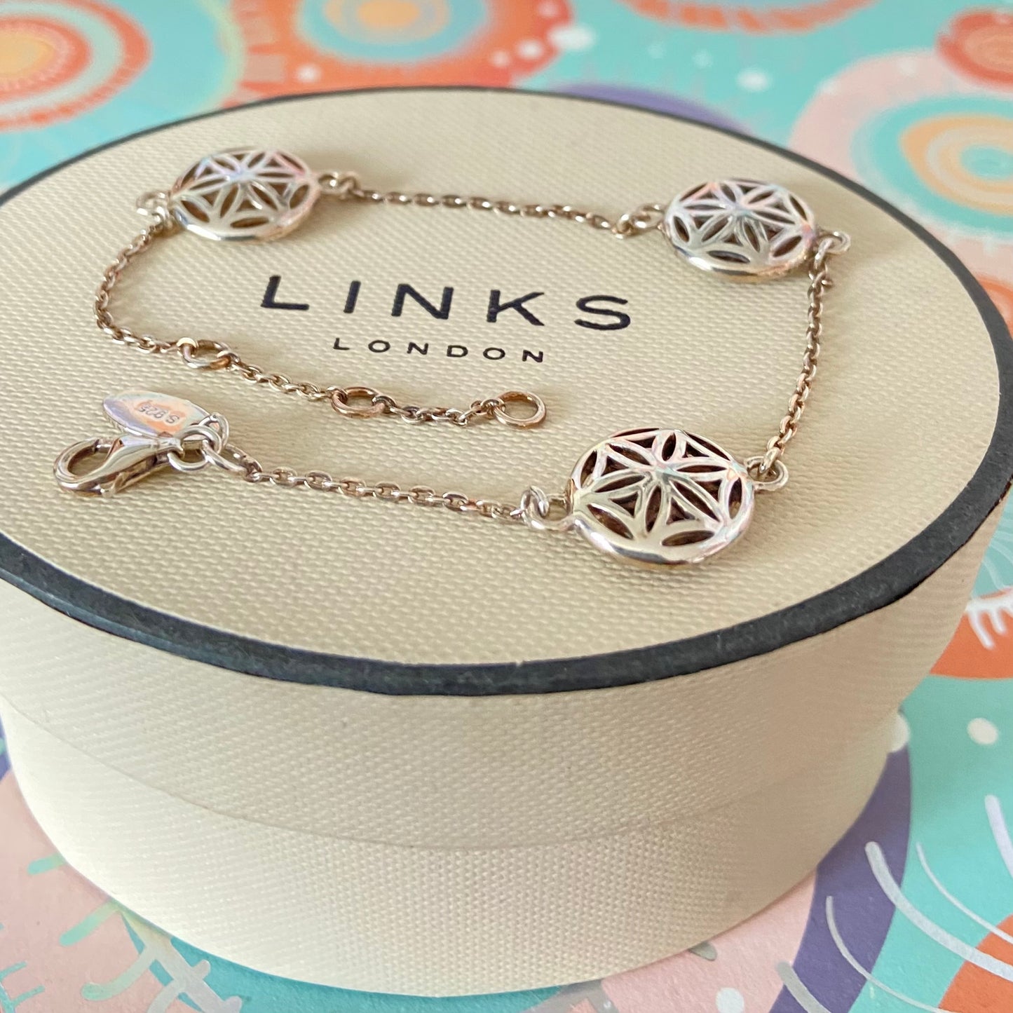 Links of London Bracelet featuring 3 disks with the Flower of Life Design. 20cm adjustable
