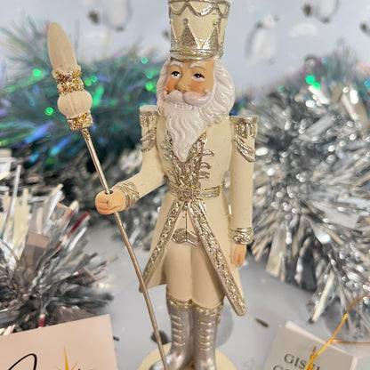 Gisela Graham cream and silver nutcracker figurine holding a staff.