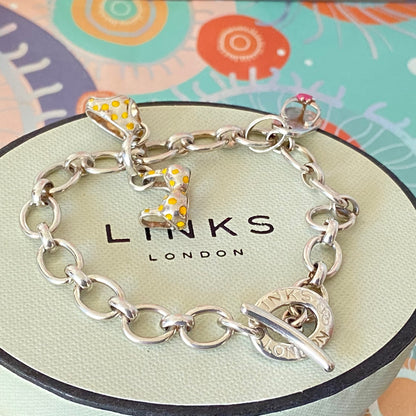 Links of London T-Bar Signature Bracelet with a Flip Flop and Yellow Polka Dot Bikini.