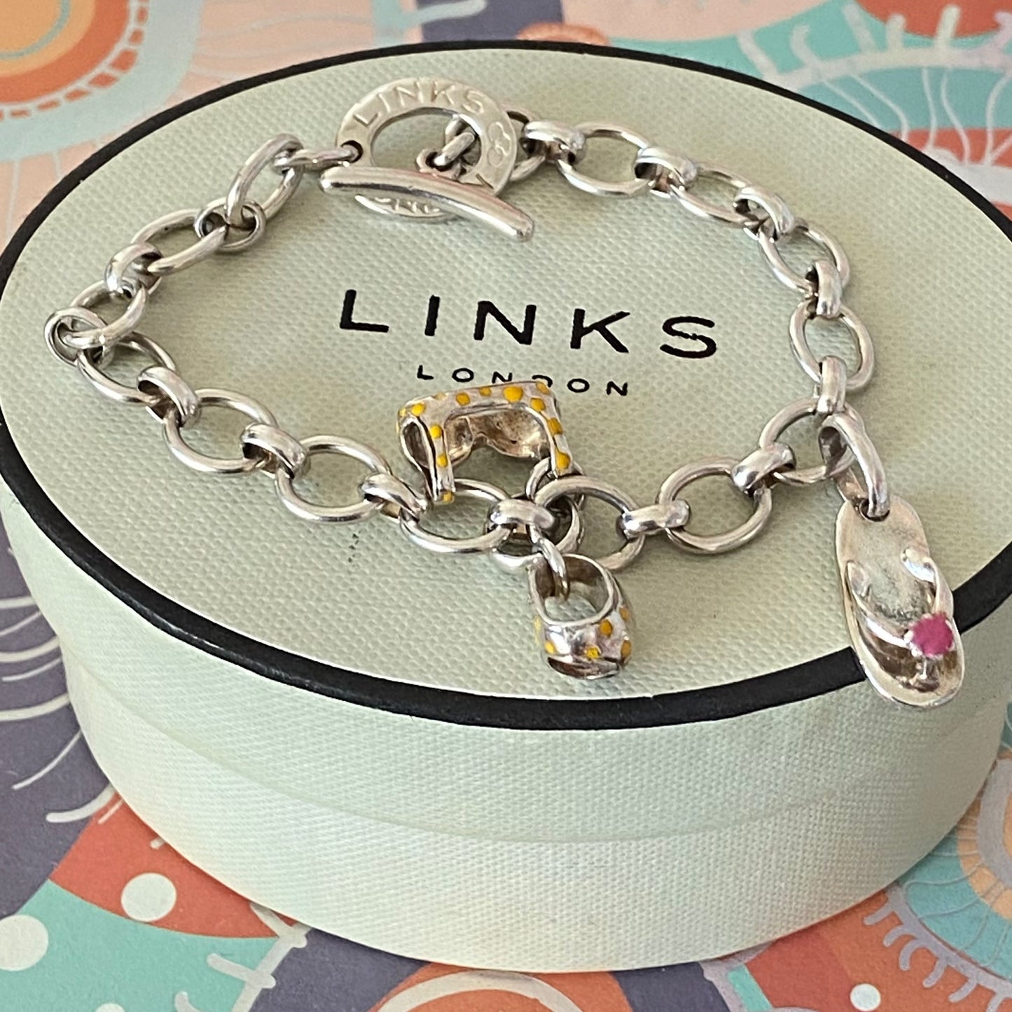 Links of London T-Bar Signature Bracelet with a Flip Flop and Yellow Polka Dot Bikini.