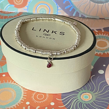 Dainty Links of London Sweetie Bracelet with Ruby Mini Birthstone Charm.
