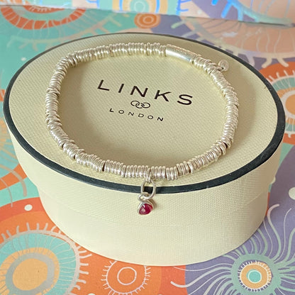 Dainty Links of London Sweetie Bracelet with Ruby Mini Birthstone Charm.
