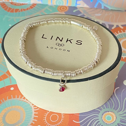 Dainty Links of London Sweetie Bracelet with Ruby Mini Birthstone Charm.
