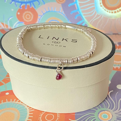 Dainty Links of London Sweetie Bracelet with Ruby Mini Birthstone Charm.