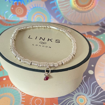 Dainty Links of London Sweetie Bracelet with Ruby Mini Birthstone Charm.