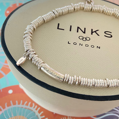 Dainty Links of London Sweetie Bracelet with Ruby Mini Birthstone Charm.