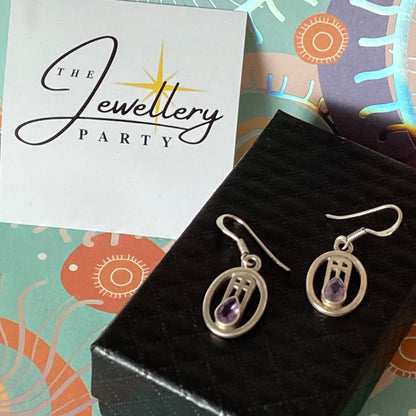 Sterling Silver lovely Earrings with a Purple Sparkly Stone