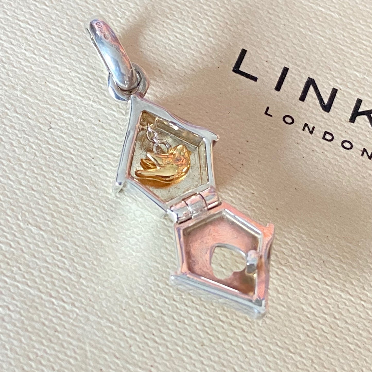 New! Links of London Bird House Charm crafted from Sterling Silver with a Gold 18k Vermeil Bird