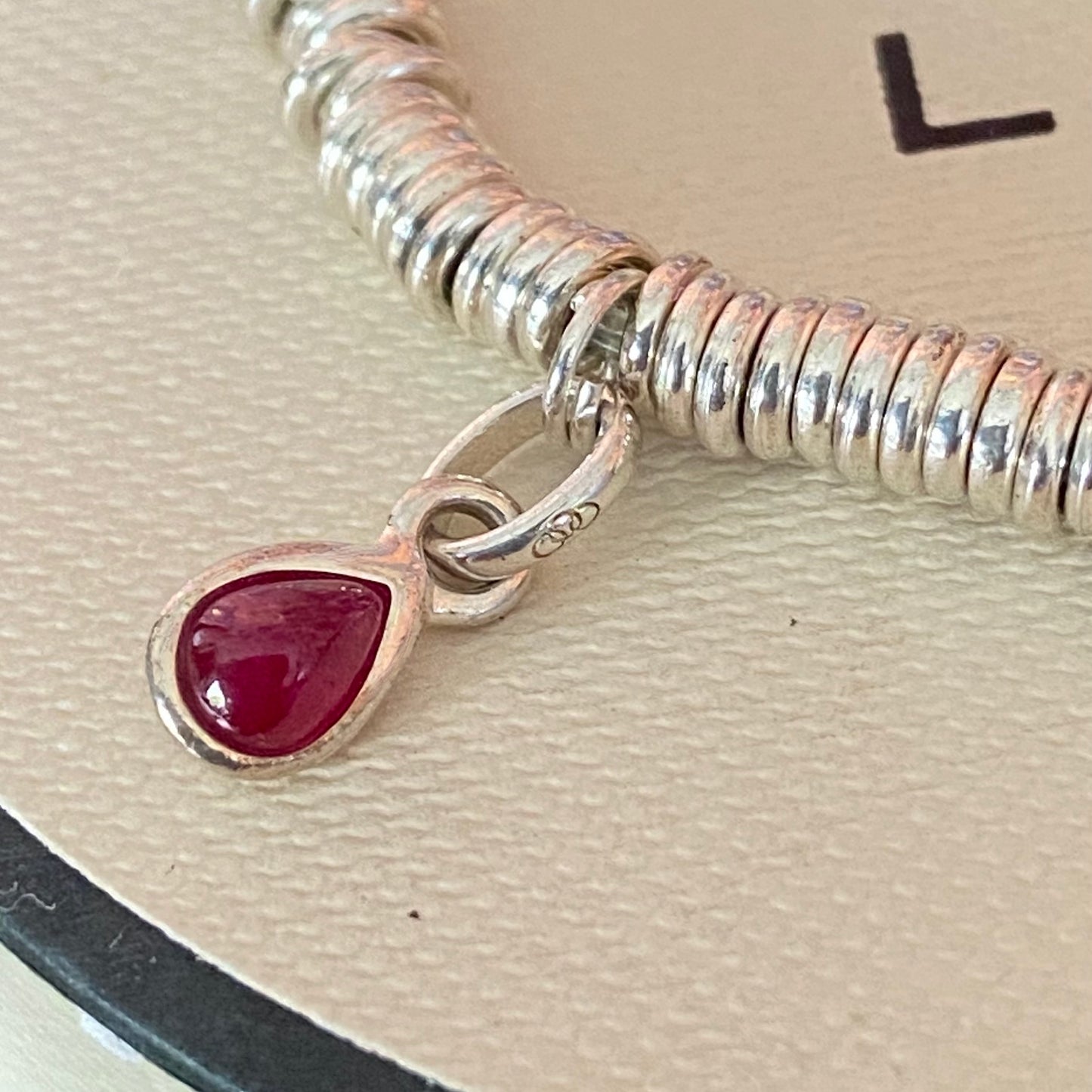 Dainty Links of London Sweetie Bracelet with Ruby Mini Birthstone Charm.