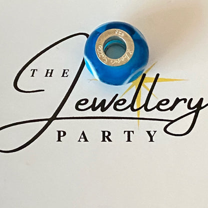 Blue Glass charm with circles by Rhona Sutton Crafted in Sterling Silver and Glass.
