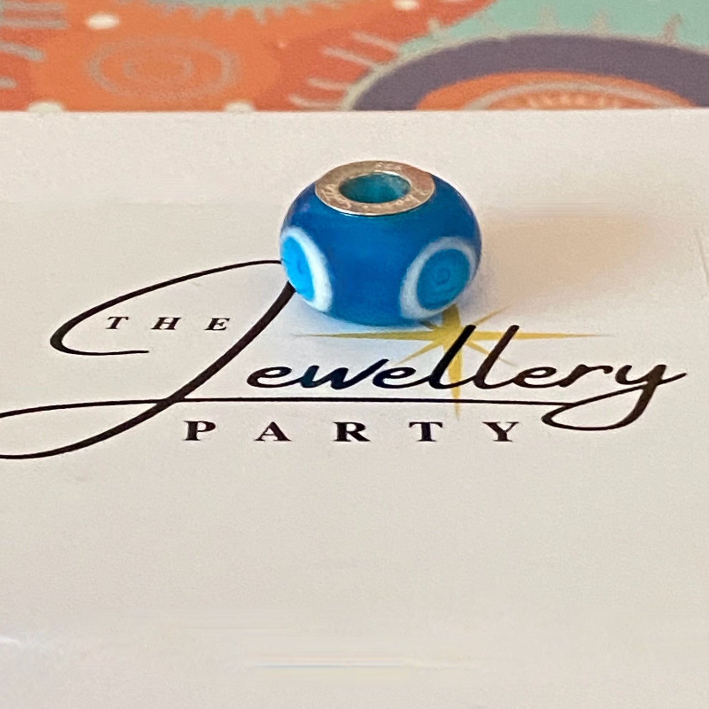 Blue Glass charm with circles by Rhona Sutton Crafted in Sterling Silver and Glass.