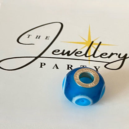 Blue Glass charm with circles by Rhona Sutton Crafted in Sterling Silver and Glass.