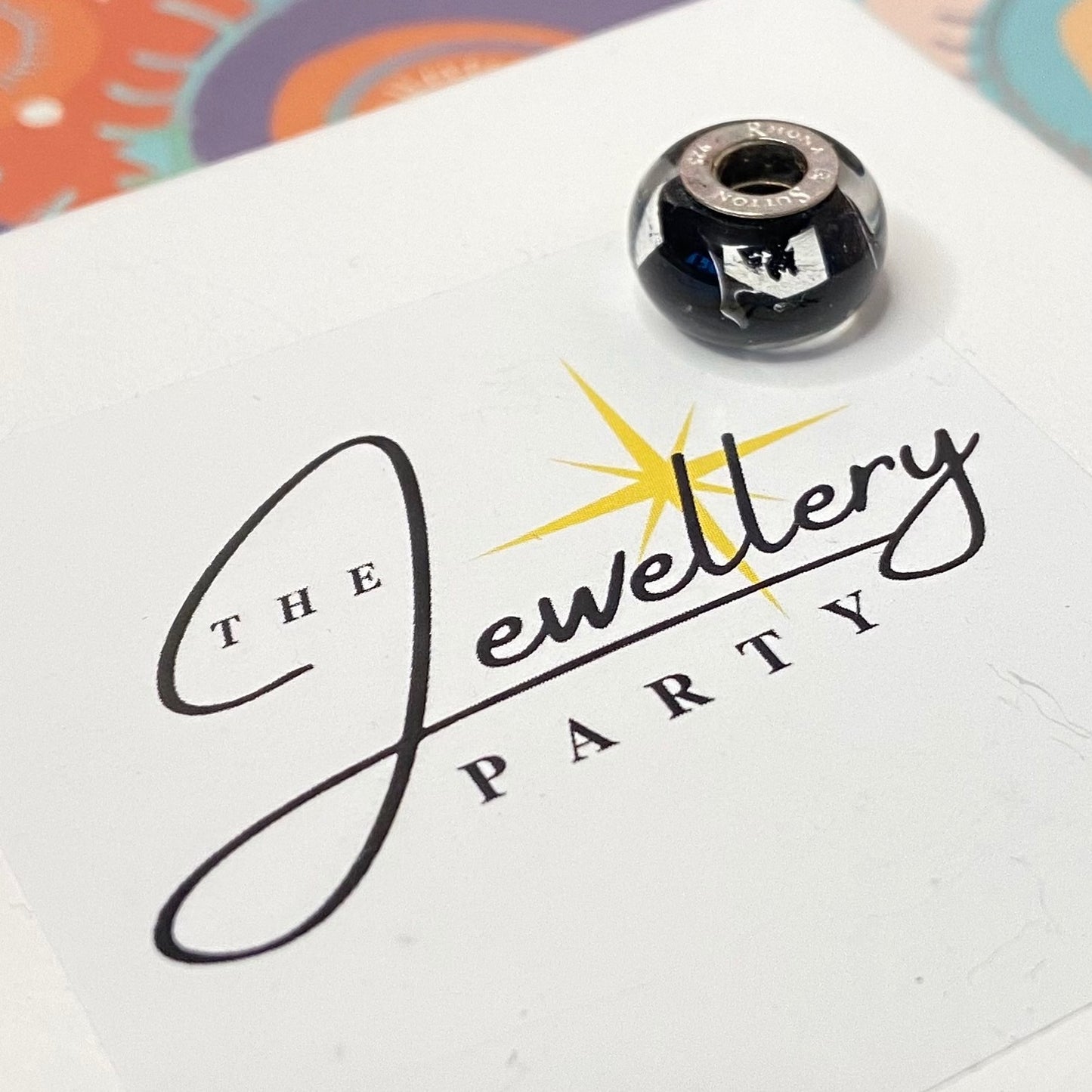 Black Glass charm with Silver stamps Design by Rhona Sutton Crafted in Sterling Silver and Glass.