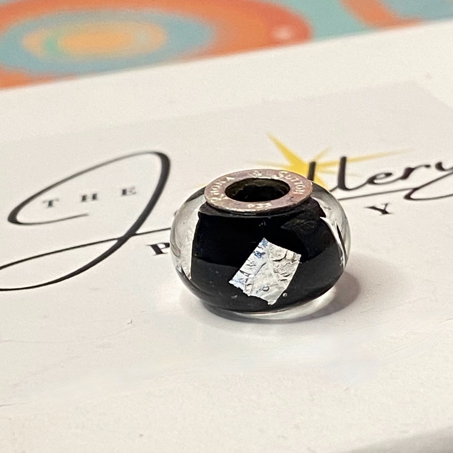 Black Glass charm with Silver stamps Design by Rhona Sutton Crafted in Sterling Silver and Glass.
