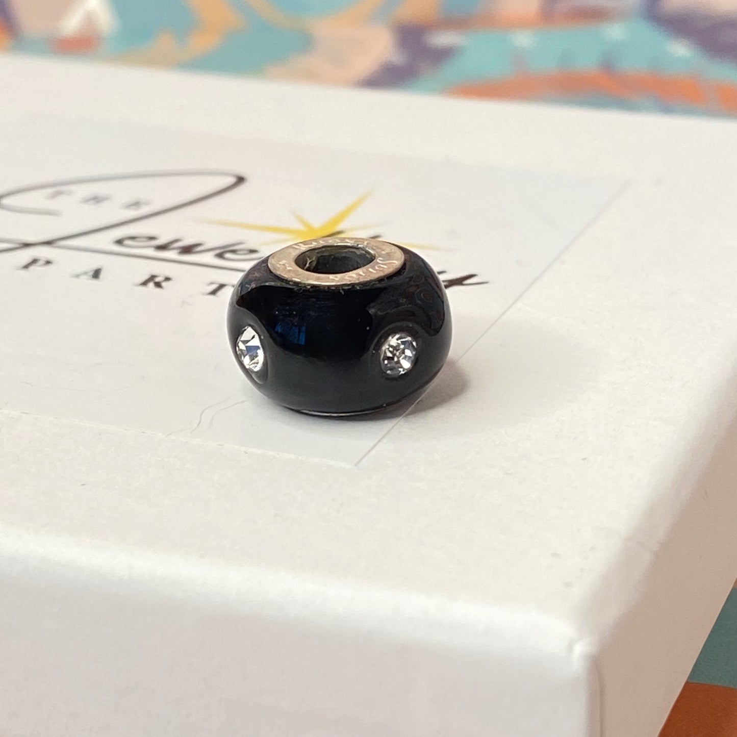 Black Glass charm with 4 Sparkle Crystals Design by Rhona Sutton Crafted in Sterling Silver and Glass.