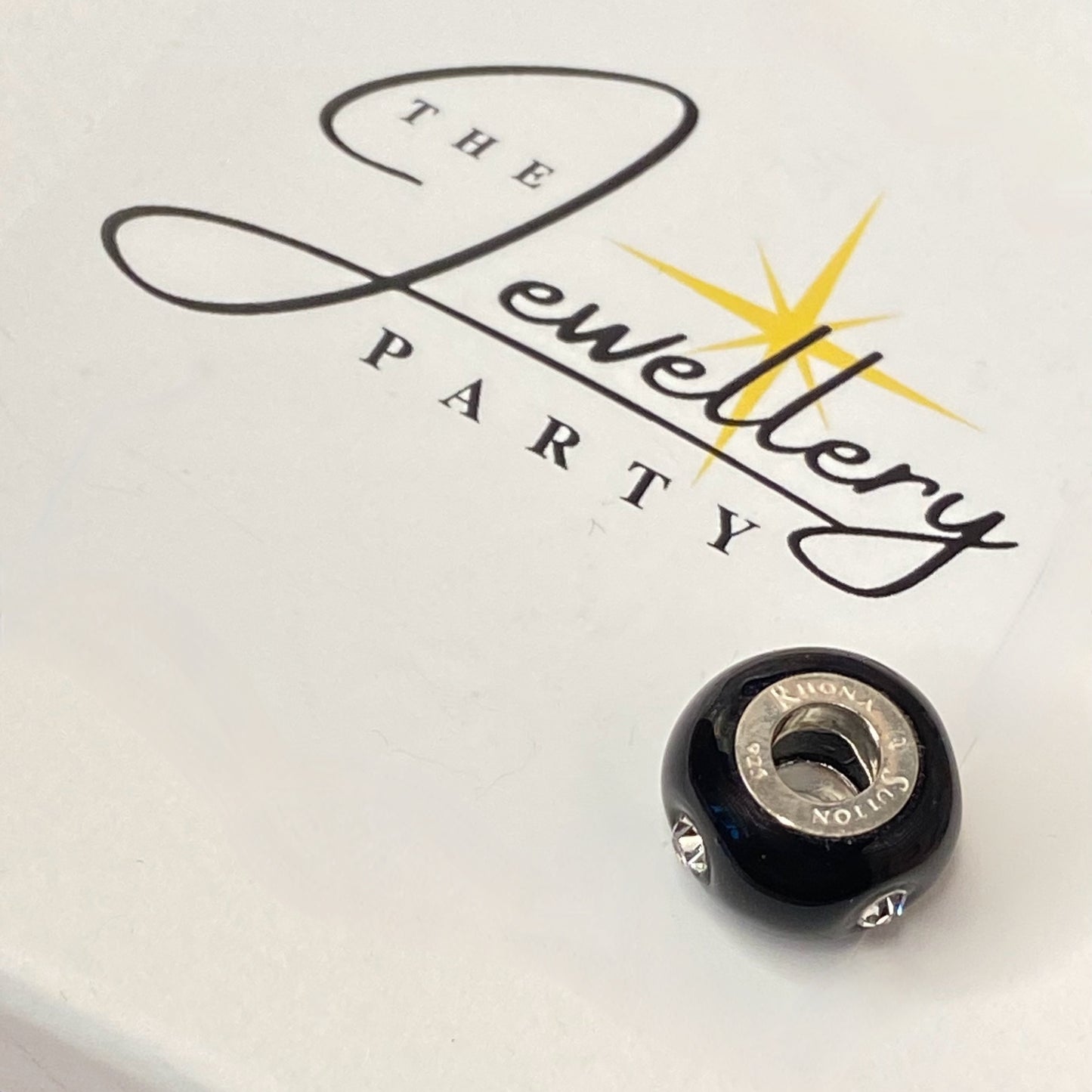 Black Glass charm with 4 Sparkle Crystals Design by Rhona Sutton Crafted in Sterling Silver and Glass.