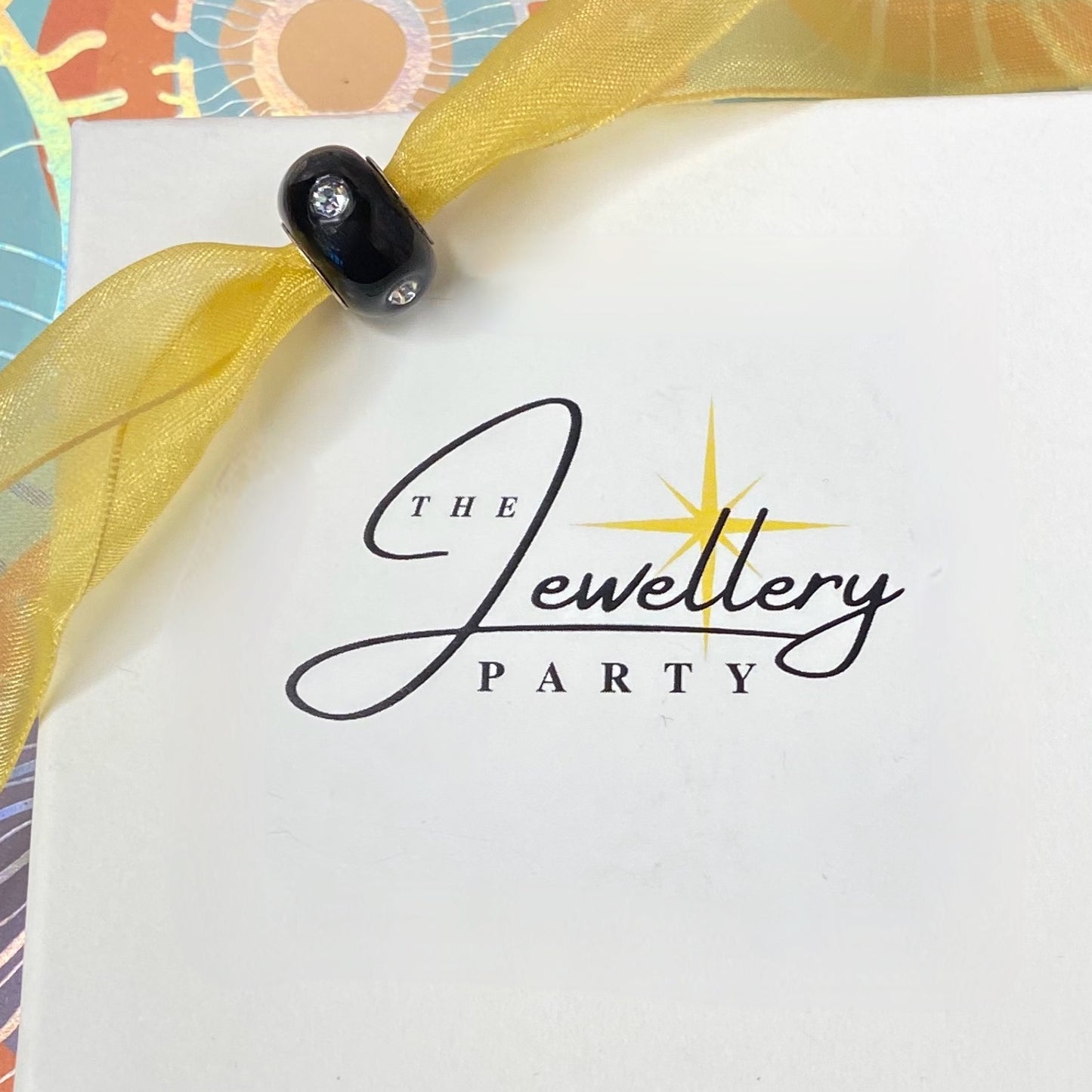 Black Glass charm with 4 Sparkle Crystals Design by Rhona Sutton Crafted in Sterling Silver and Glass.