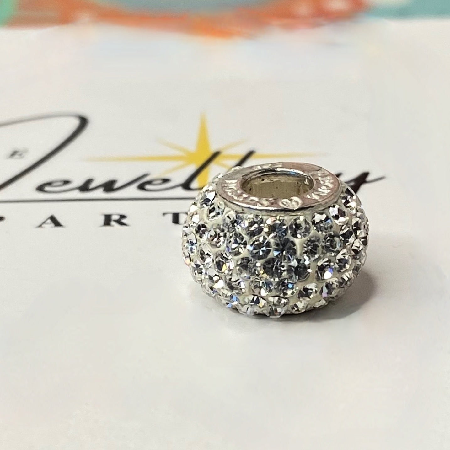 Silver charm with pave- set cubic zirconia Design by Rhona Sutton Crafted in Sterling Silver