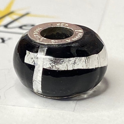 Black charm with Silver Stripe and cross Design by Rhona Sutton Crafted in Sterling Silver