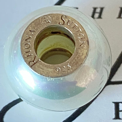 Pearl effect charm with Silver stamps Design by Rhona Sutton Crafted in Sterling Silver and Glass.