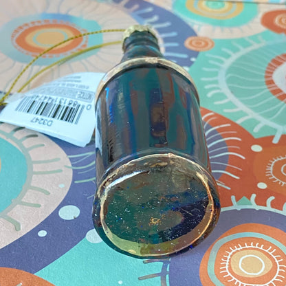 The item is a glass "Whiskey me AWAY" Christmas ornament, often manufactured by brands like Cody Foster & Co. or Kurt Adler.