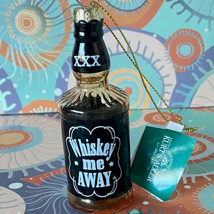 The item is a glass "Whiskey me AWAY" Christmas ornament, often manufactured by brands like Cody Foster & Co. or Kurt Adler.