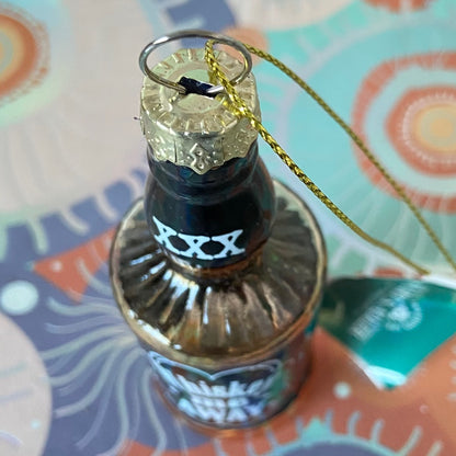 The item is a glass "Whiskey me AWAY" Christmas ornament, often manufactured by brands like Cody Foster & Co. or Kurt Adler.