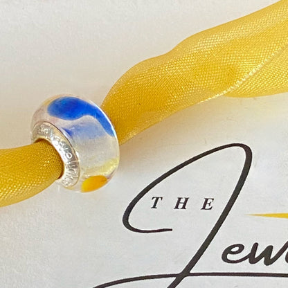 LoveLinks white  Bead design with dashes of yellow, blue and orange Crafted from Sterling Silver and Murano Glass