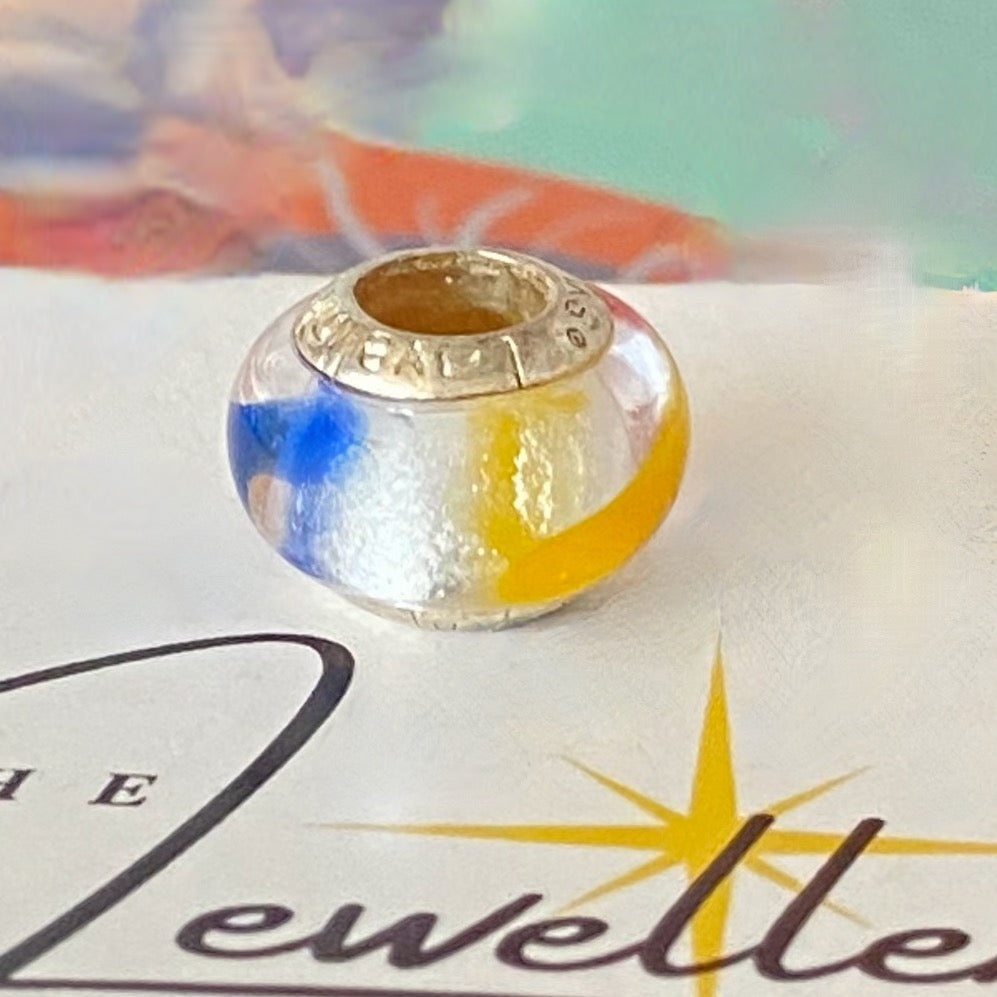 LoveLinks white  Bead design with dashes of yellow, blue and orange Crafted from Sterling Silver and Murano Glass