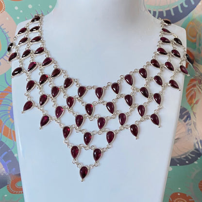 Stunning Statement Necklace crafted in Sterling Silver with Tear drop Garnets