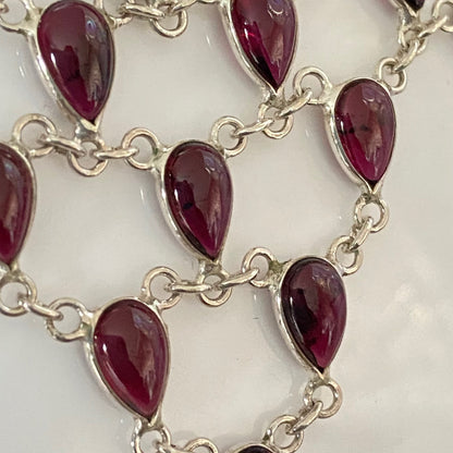 Stunning Statement Necklace crafted in Sterling Silver with Tear drop Garnets