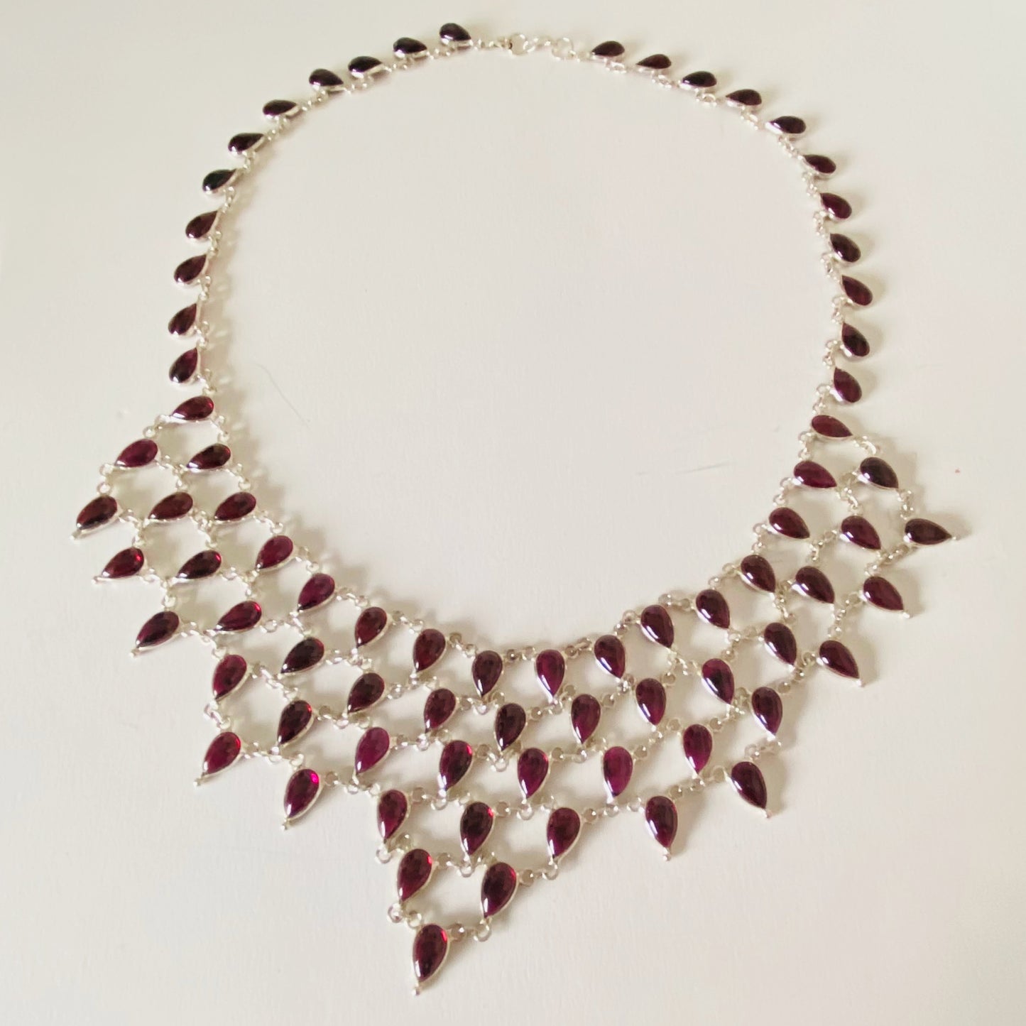 Stunning Statement Necklace crafted in Sterling Silver with Tear drop Garnets
