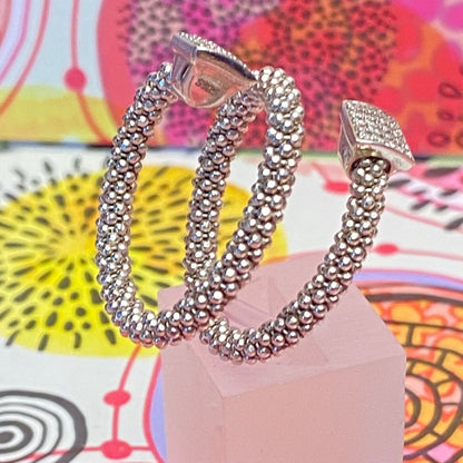 Links of London Sterling Silver Star Dust Wrap Ring with square barrels covered with Sparkly stones.