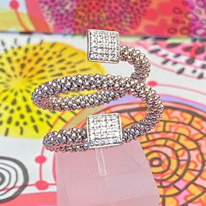 Links of London Sterling Silver Star Dust Wrap Ring with square barrels covered with Sparkly stones.