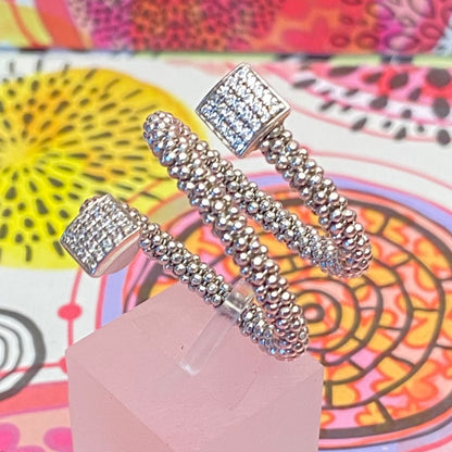 Links of London Sterling Silver Star Dust Wrap Ring with square barrels covered with Sparkly stones.