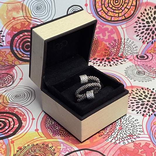 Links of London Sterling Silver Star Dust Wrap Ring with Round barrels covered with Sparkly stones.