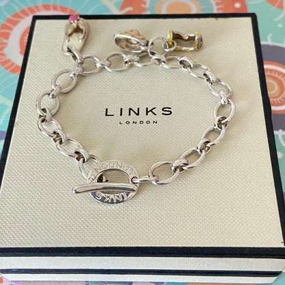 Links of London T-Bar Signature Bracelet with a Flip Flop and Yellow Polka Dot Bikini.