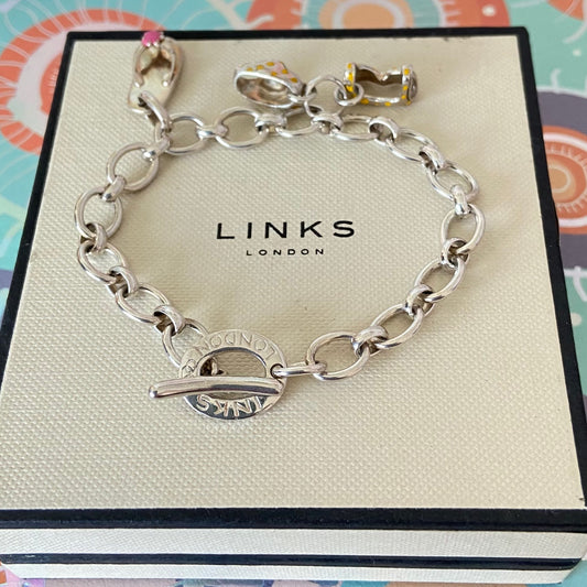 Links of London T-Bar Signature Bracelet with a Flip Flop and Yellow Polka Dot Bikini.