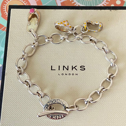 Links of London T-Bar Signature Bracelet with a Flip Flop and Yellow Polka Dot Bikini.