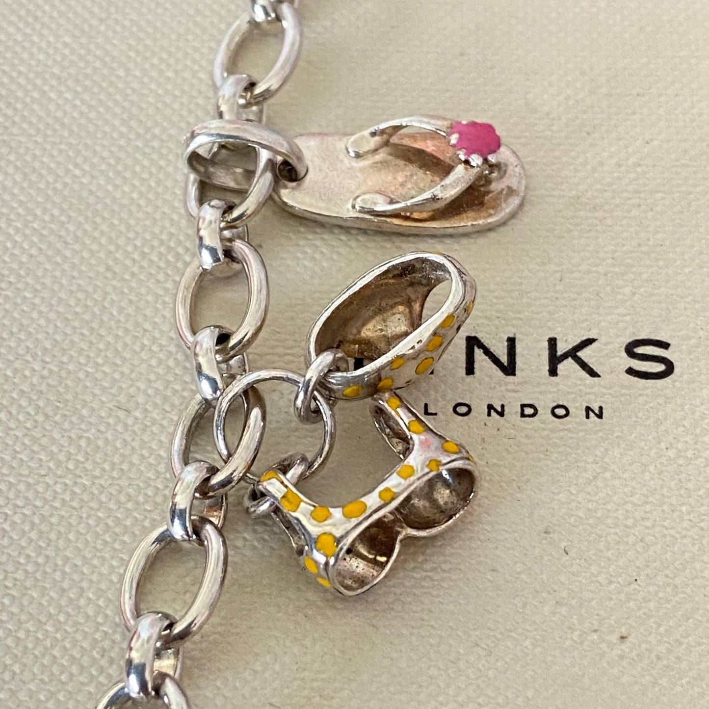 Links of London T-Bar Signature Bracelet with a Flip Flop and Yellow Polka Dot Bikini.